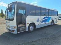 2012 Hino Melpha exterior view of the passenger entry door.