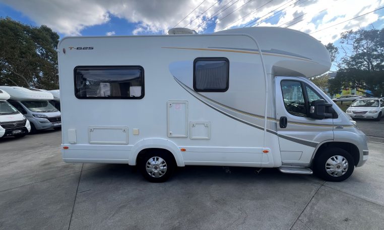 Side view of a 2017 Auto-Trail Tribute 625 motorhome showing the driver's door.