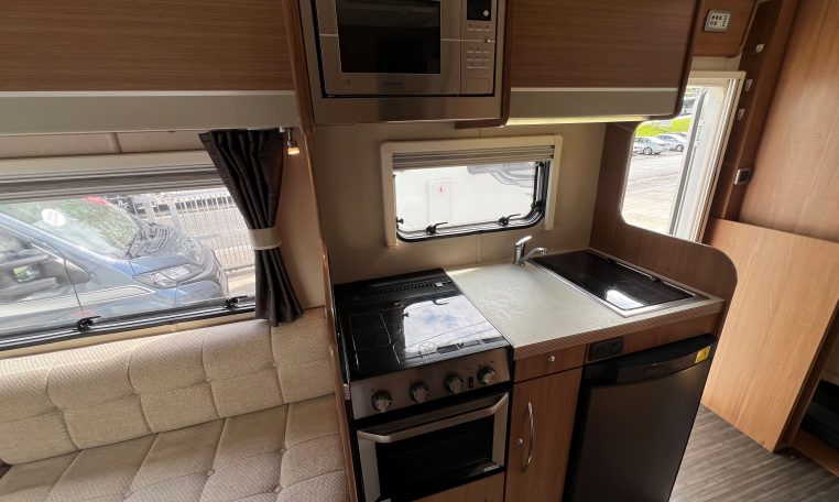 Compact 2017 Auto-Trail Tribute 625 motorhome kitchen with fridge, oven and smart storage cupboards