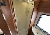 Spacious separate shower inside the 2017 Auto-Trail Tribute 625 motorhome, featuring modern fittings and bright lighting.