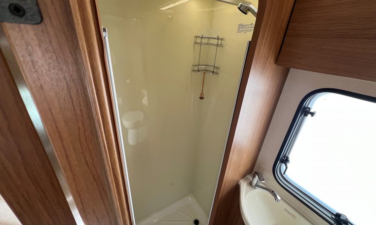 Spacious separate shower inside the 2017 Auto-Trail Tribute 625 motorhome, featuring modern fittings and bright lighting.