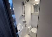 2017 Jayco Conquest FA24-1 interior view showing the bathroom with shower, toilet and handbasin.