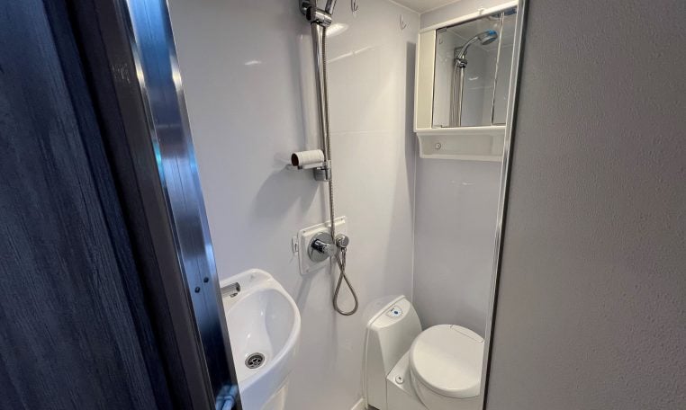 2017 Jayco Conquest FA24-1 interior view showing the bathroom with shower, toilet and handbasin.