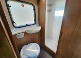 2018 Auto-Trail Imala 720 motorhome interior view showing the bathroom with compact toilet and separate shower.