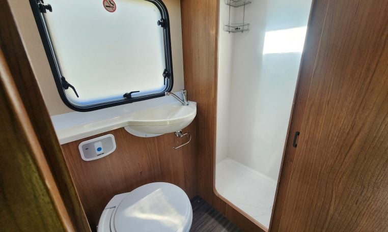 2018 Auto-Trail Imala 720 motorhome interior view showing the bathroom with compact toilet and separate shower.