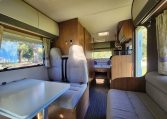 2018 Auto-Trail Imala 720 motorhome interior view showing the rear lounge converted into a bed.