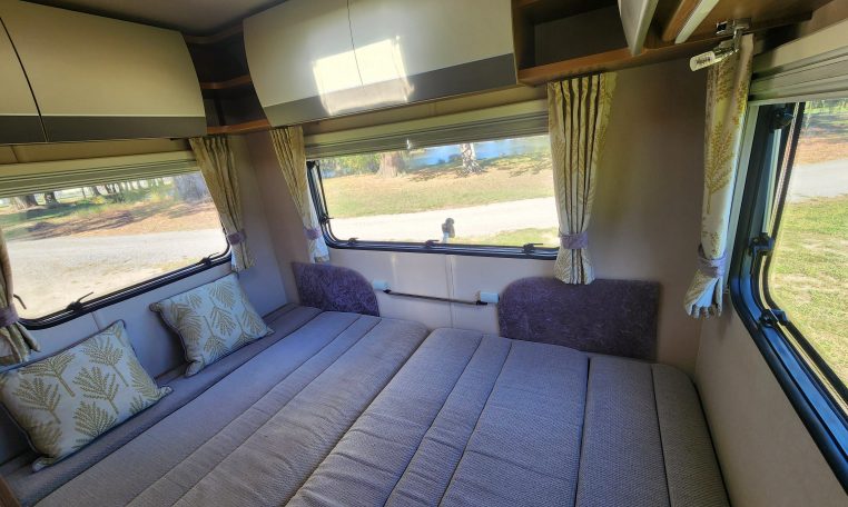 2018 Auto-Trail Imala 720 motorhome interior view showing the rear lounge converted into a bed.