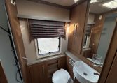 2018 Auto-Trail Tracker RS motorhome interior view of the bathroom showing the shower, handbasin and toilet.