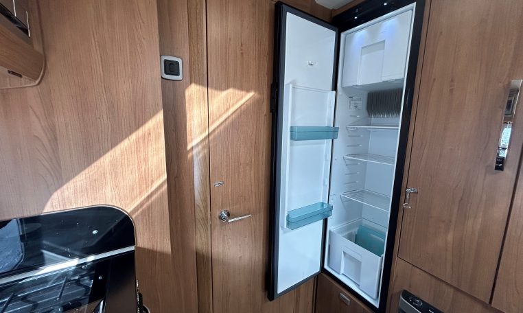 2018 Auto-Trail Tracker RS motorhome interior view showing the opened fridge.