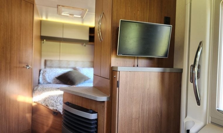 2018 Auto-Trail Tribute 715 motorhome interior view showing the TV in the living room.