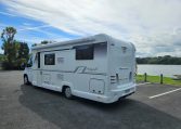 2018 Bailey Autograph 79-4T side view with habitation door and awning providing entry and outdoor coverage.