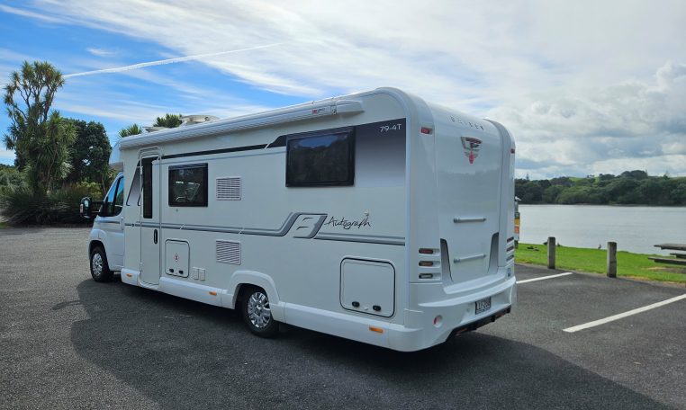 2018 Bailey Autograph 79-4T side view with habitation door and awning providing entry and outdoor coverage.