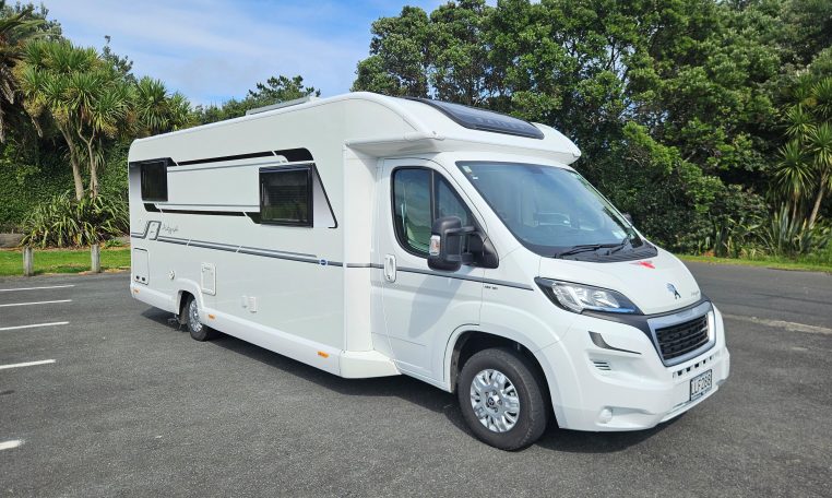 Side view of a 2018 Bailey Autograph 79-4T motorhome showing the driver's door.