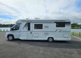 Side view of a 2018 Bailey Autograph 79-4T motorhome showing the habitation door and camper exterior.