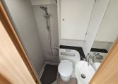 Interior view of the 2018 Bailey Autograph 79-4T motorhome bathroom with shower and modern design.