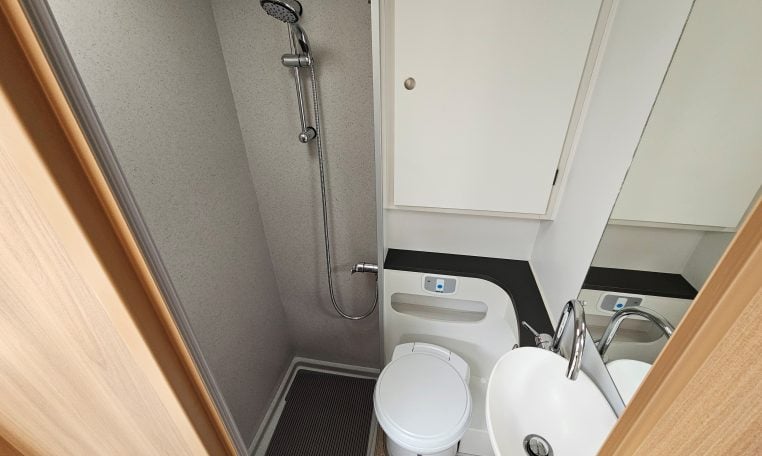 Interior view of the 2018 Bailey Autograph 79-4T motorhome bathroom with shower and modern design.