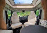 Cab seats with swivel function creating extra seating in the 2018 Bailey Autograph 79-4T motorhome.
