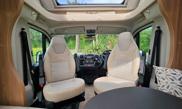 Cab seats with swivel function creating extra seating in the 2018 Bailey Autograph 79-4T motorhome.