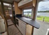 Kitchen benchtop extension inside a 2018 Bailey Autograph 79-4T motorhome providing ample workspace.