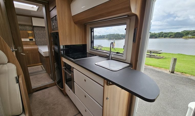 Kitchen benchtop extension inside a 2018 Bailey Autograph 79-4T motorhome providing ample workspace.