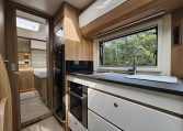 2018 Bailey Autograph 79-4T motorhome kitchen with fridge, oven and storage cupboards in a compact, practical layout