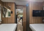 TV mounted inside the 2018 Bailey Autograph 79-4T motorhome rear bedroom area.