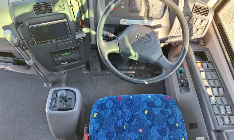 2018 Hino Melpha interior view showing the dash and driver area.