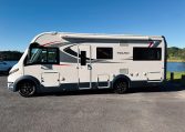 2018 Roller Team Pegaso 745 exterior showing the passenger side profile next to the lake.