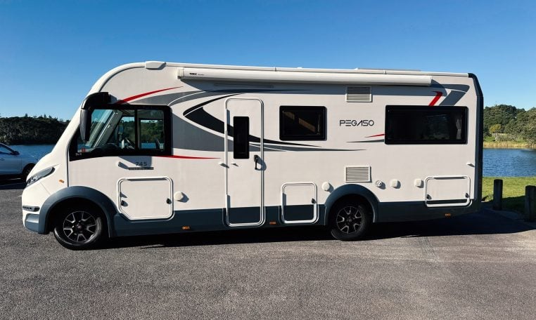 2018 Roller Team Pegaso 745 exterior showing the passenger side profile next to the lake.