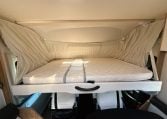 2018 Roller Team Pegaso 745 interior with drop-down bed and ladder.
