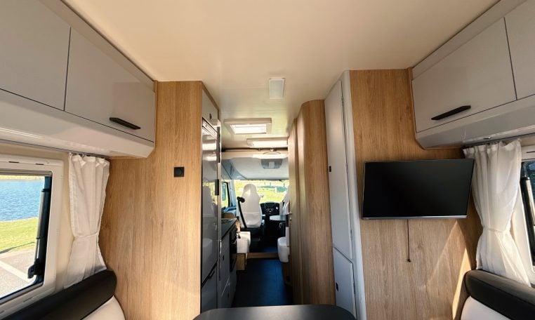 2018 Roller Team Pegaso 745 interior view of the hallway, TV, kitchen and cab.