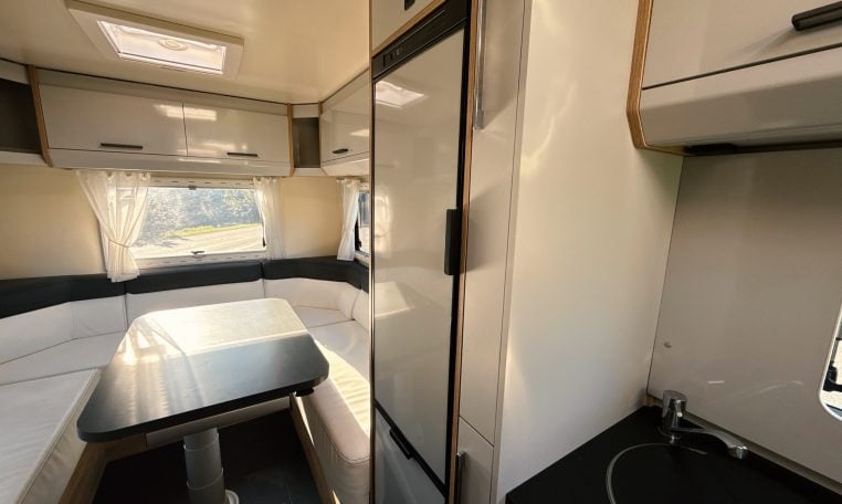 2018 Roller Team Pegaso 745 interior rear U-shaped lounge/dining and fridge.