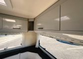2018 Roller Team Pegaso 745 interior rear U-shaped lounge overhead cabinets.
