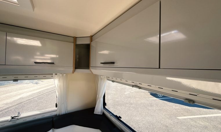2018 Roller Team Pegaso 745 interior rear U-shaped lounge overhead cabinets.