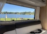 2018 Roller Team Pegaso 745 interior rear U-shaped lounge window and lake side view