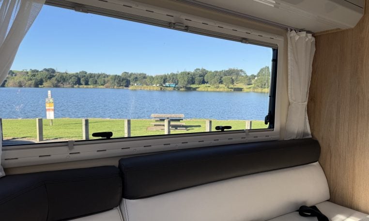 2018 Roller Team Pegaso 745 interior rear U-shaped lounge window and lake side view