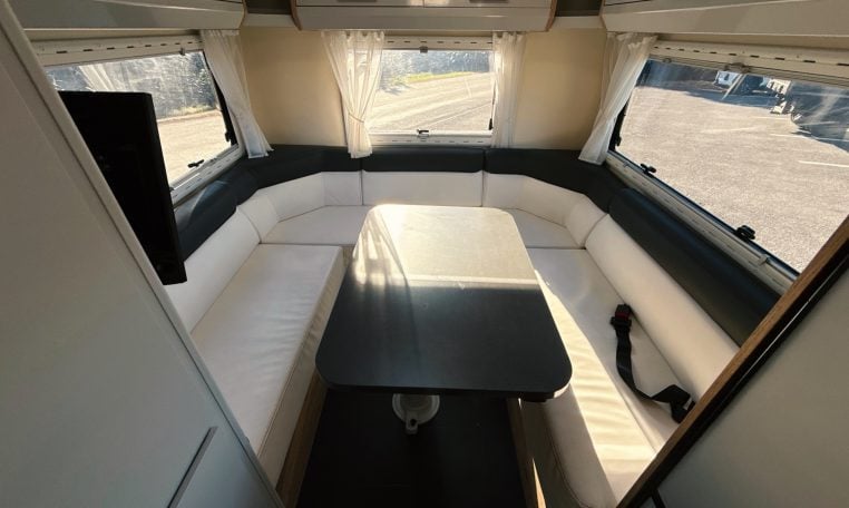 2018 Roller Team Pegaso 745 interior rear U-shaped lounge seating and table