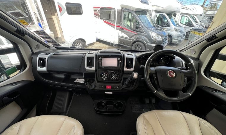 2019 Auto-Trail Frontier Delaware S interior view showing the front cab with steering wheel and dashboard.