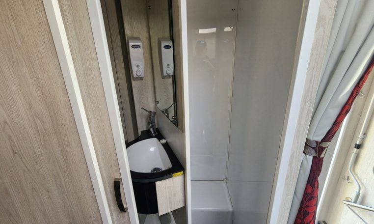 2019 Iveco Daily 50-210 interior view showing the split room divider in the bathroom.