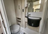 2019 Iveco Daily 50-210 interior view showing the bathroom with the toilet and handbasin.