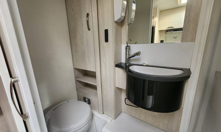 2019 Iveco Daily 50-210 interior view showing the bathroom with the toilet and handbasin.