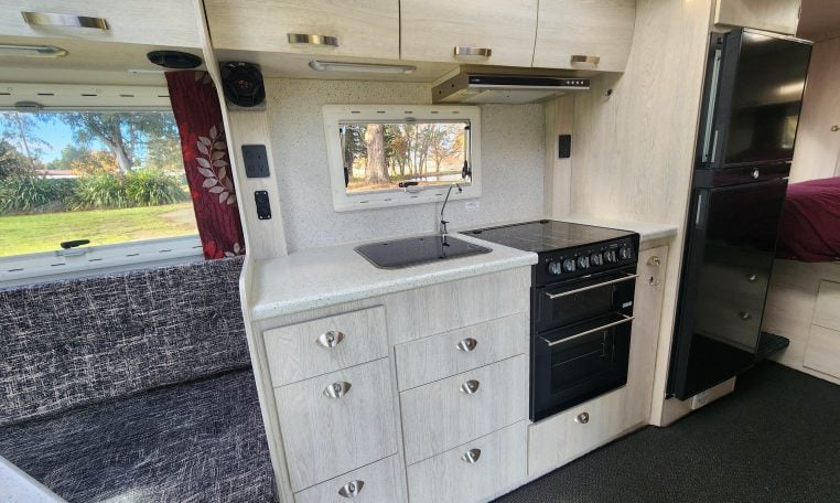 2019 Iveco Daily 50-210 interior view showing the kitchen with oven and grill.