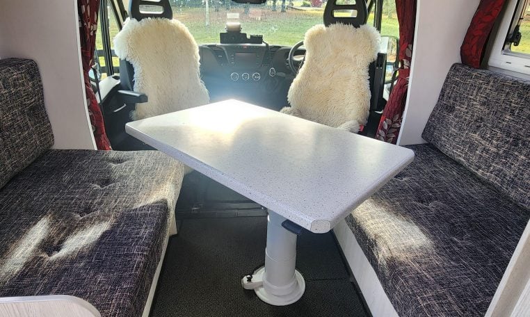 2019 Iveco Daily 50-210 interior view showing the spacious front lounge and dining table.