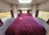 2019 Iveco Daily 50-210 interior view showing the rear bedroom with an island bed.