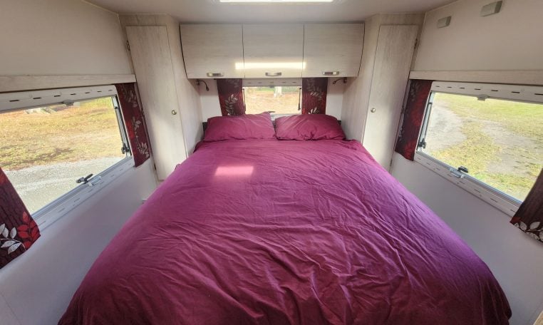 2019 Iveco Daily 50-210 interior view showing the rear bedroom with an island bed.
