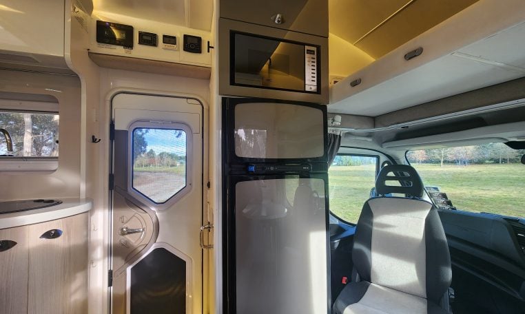 2019 Iveco Sunliner Switch interior view showing the fridge and microwave.