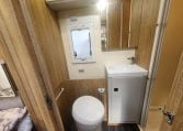 2019 Roller Team T-Line 785 interior view showing the bathroom with toilet and handbasin.