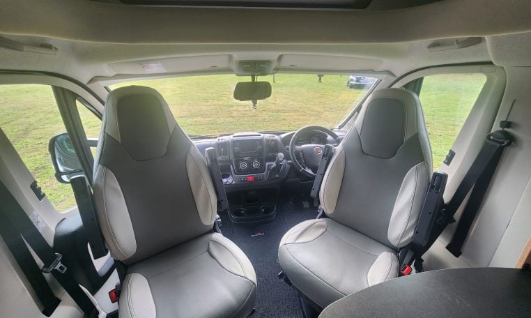 2019 Roller Team T-Line 785 interior view showing the front cab with swivel seats.