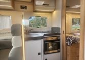 2019 Roller Team T-Line 785 interior view showing the kitchen with oven.