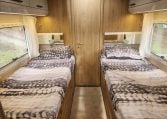 2019 Roller Team T-Line 785 interior view showing the fixed twin single beds.